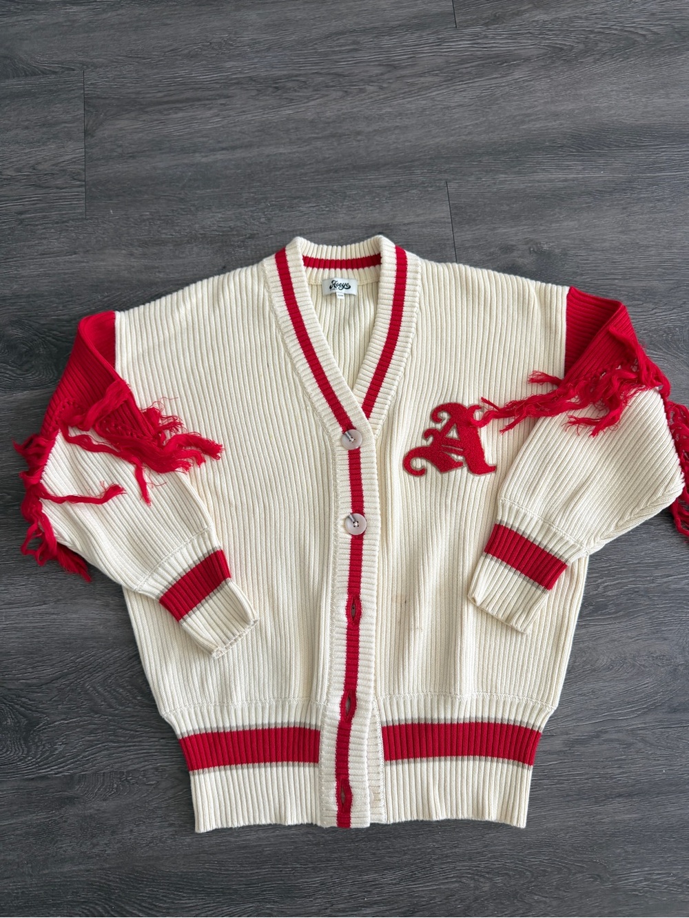 Aseye Studios Cream V‑Neck Cardigan with Red Fringe Trim